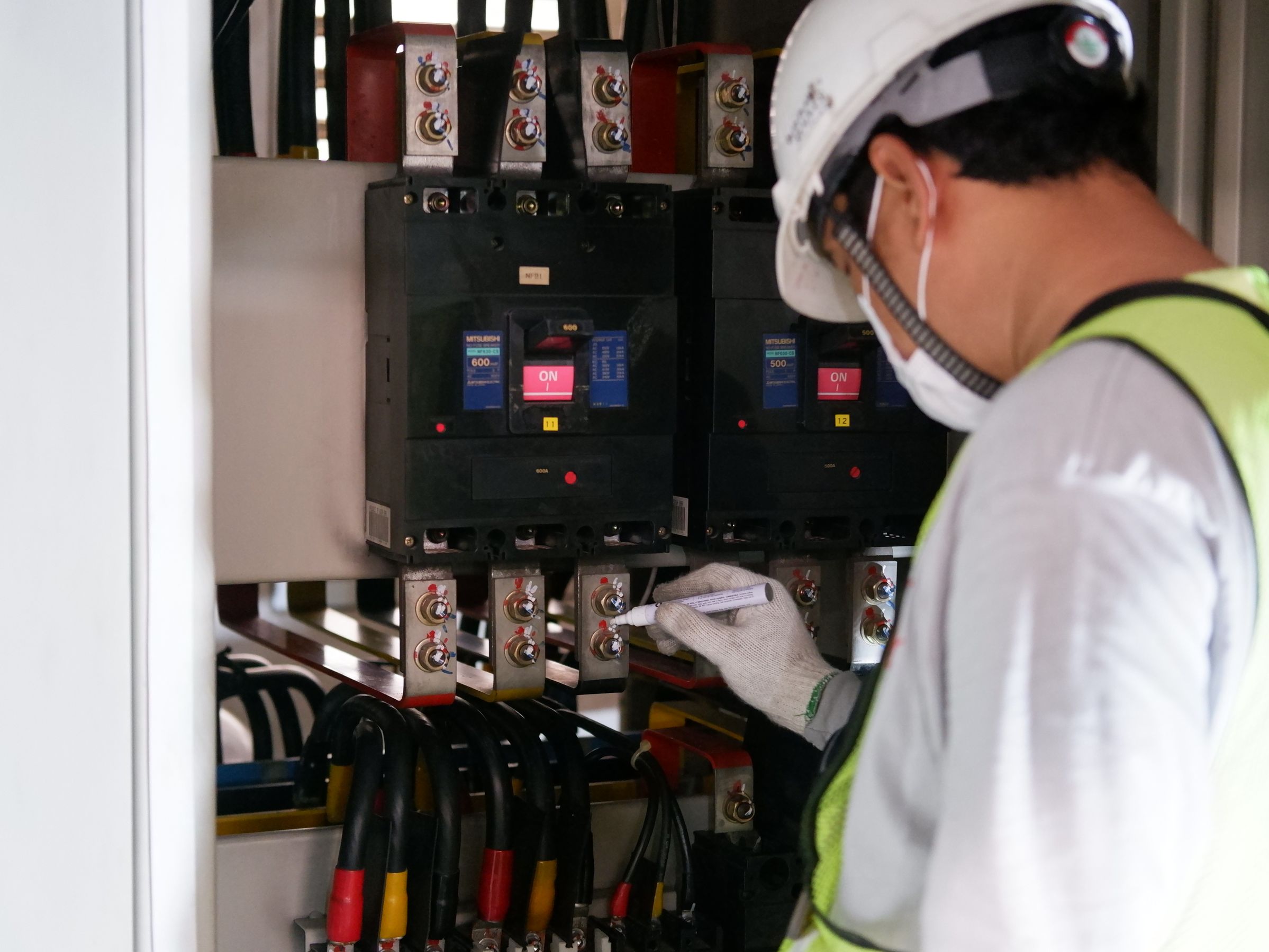 Engineer testing a circuit breaker — Megawin Switchgear, Salem